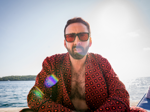 Nicolas Cage (“Nick Cage”) contemplates his career while poolside in Mallorca, Spain in <em>The Unbearable Weight of Massive Talent</em>. Photo Credit: Katalin Vermes/Lionsgate. The Unbearable Weight of Massive Talent