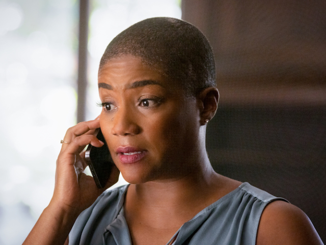 Tiffany Haddish (“Vivian”) makes an important call in <em>The Unbearable Weight of Massive Talent</em>. Photo Credit: Karen Ballard/Lionsgate. The Unbearable Weight of Massive Talent