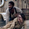 (From left) Clemens (Corey Hawkins) and Anna (Aisling Franciosi) in "The Last Voyage of the Demeter."