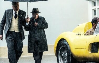 Adam Driver (left) plays Enzo Ferrari preparing for the 1957 Mille Miglia race in "Ferrari."