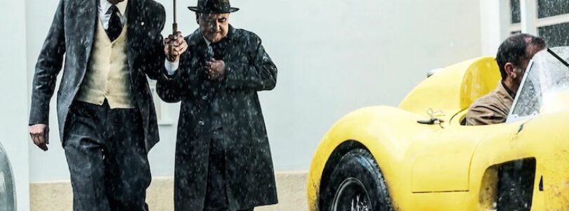 Adam Driver (left) plays Enzo Ferrari preparing for the 1957 Mille Miglia race in "Ferrari."