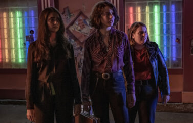 Geraldine Viswanathan (l-r), Margaret Qualley, and Beanie Feldstein in director Ethan Coen's "Drive-Away Dolls."