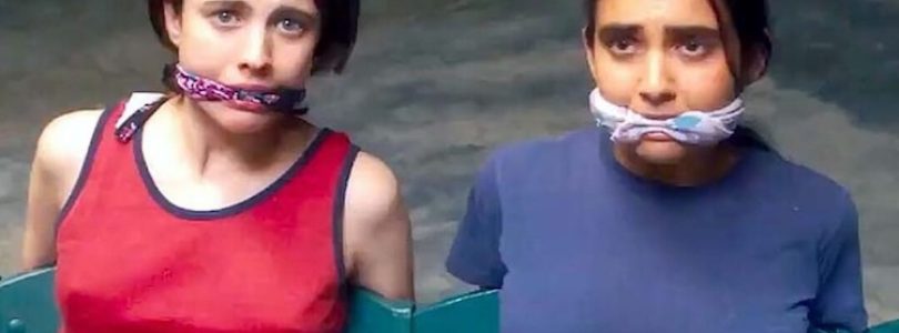 Margaret Qualley and Geraldine Viswanathan in "Drive-Away Dolls."