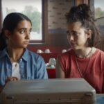 Geraldine Viswanathan and Margaret Qualley in "Drive-Away Dolls."