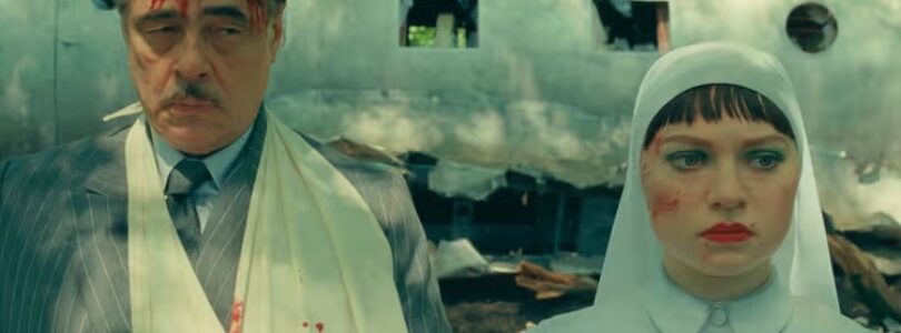 Benicio Del Toro (left) as Zsa-Zsa Korda and Mia Threapleton as Liesl in “The Phoenician Scheme.”