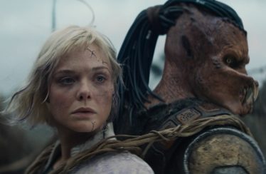 Dimitrius Schuster-Koloamatangi and Elle Fanning in “Predator: Badlands.”