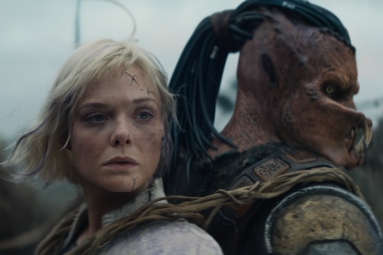 Dimitrius Schuster-Koloamatangi and Elle Fanning in “Predator: Badlands.”